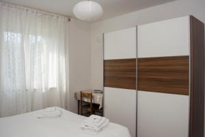 A bed or beds in a room at Casa Martello