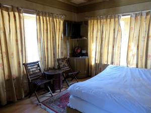 Cama o camas de una habitación en Hotel Nezer Holiday Inn