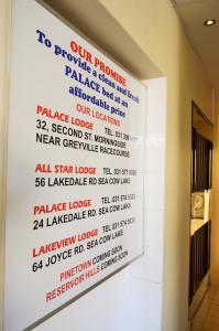 a wall with a sign that reads our promise to promise a glass clean and heal at Palace Lodge Morningside in Durban