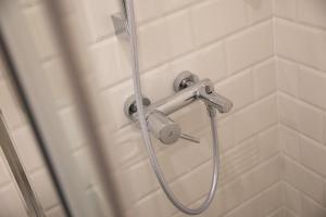a shower with a hose in a bathroom at Villa Four Winds III in Dubrovnik