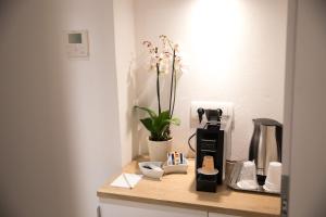 a counter with a coffee maker and a coffee pot at Villa Four Winds III in Dubrovnik