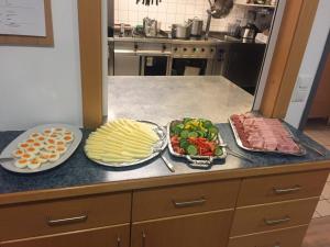 a kitchen with two plates of food on a counter at Gästehaus Ulrichsberg in Ulrichsberg