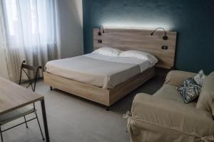 Postel nebo postele na pokoji v ubytování Casa Chiara B&B