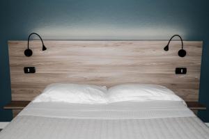 Postel nebo postele na pokoji v ubytování Casa Chiara B&B