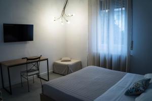 Postel nebo postele na pokoji v ubytování Casa Chiara B&B