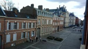 a group of people standing in front of buildings at Maison Ulysse in Amiens