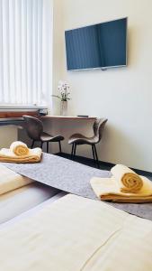 Postel nebo postele na pokoji v ubytování CREO Munich City
