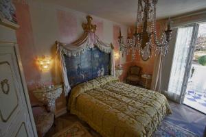 Postel nebo postele na pokoji v ubytování B&B La Maison degli Angeli