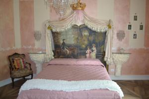 Postel nebo postele na pokoji v ubytování B&B La Maison degli Angeli