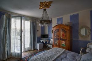 Postel nebo postele na pokoji v ubytování B&B La Maison degli Angeli