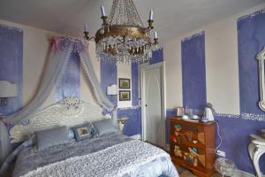 Postel nebo postele na pokoji v ubytování B&B La Maison degli Angeli