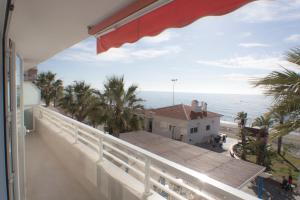 a balcony with a view of the ocean at Apartamento Mediterráneo in Rincón de la Victoria