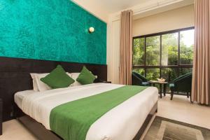 Krevet ili kreveti u jedinici u okviru objekta Tuki Resort Pokhara