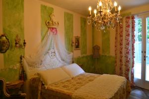 Postel nebo postele na pokoji v ubytování B&B La Maison degli Angeli