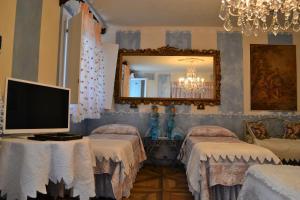 Postel nebo postele na pokoji v ubytování B&B La Maison degli Angeli