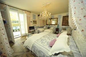 Postel nebo postele na pokoji v ubytování B&B La Maison degli Angeli