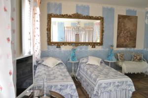 Postel nebo postele na pokoji v ubytování B&B La Maison degli Angeli