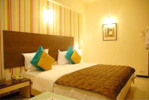 Cama o camas de una habitación en Executive Tamanna Hotel
