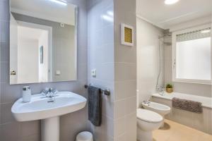 A bathroom at Lets Holidays White apartment with terrace, ac & parking, near beach