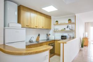 A kitchen or kitchenette at Lets Holidays White apartment with terrace, ac & parking, near beach