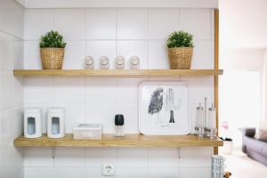 A kitchen or kitchenette at Lets Holidays White apartment with terrace, ac & parking, near beach