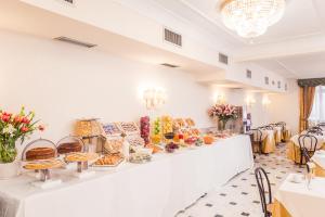 a bakery with a buffet of food on a counter at Raeli Hotel Lux in Rome