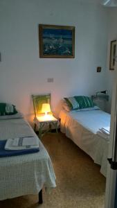 Säng eller sängar i ett rum på SanBart Villetta con Giardino