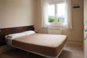 Posteľ alebo postele v izbe v ubytovaní Alberg Costa Brava