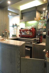 a kitchen with a stove and a counter top at Hotel Riviera Blu in Tirrenia