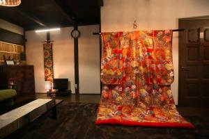 Postel nebo postele na pokoji v ubytování Kyounoyado HANA Nishijin - Kimono no Yado