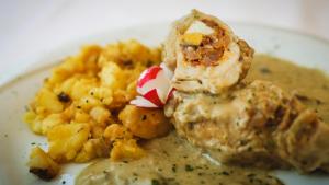 a white plate of food with food on it at Guest House Grgin Dol in Požega