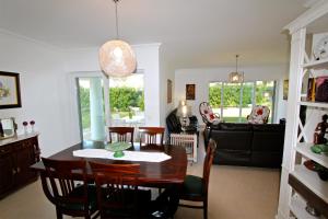 a dining room and living room with a table and chairs at Villa Violeta 51 - Clever Details in Vilamoura