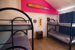 Postel nebo postele na pokoji v ubytování Wipeout Hostel