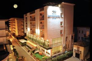 a building with a sign on the side of it at Hotel dell'Amarissimo in Bellaria-Igea Marina