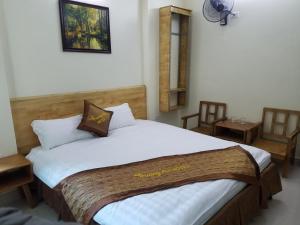 Ένα ή περισσότερα κρεβάτια σε δωμάτιο στο Trường An Hostel