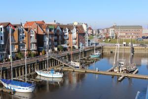 a group of boats are docked at a marina at Ferienhaus Hafenzeit in Cuxhaven