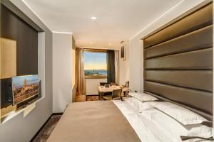 Posteľ alebo postele v izbe v ubytovaní The View Luxury Rooms