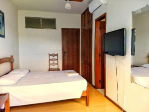 Ένα ή περισσότερα κρεβάτια σε δωμάτιο στο Hotel Vila Mineira
