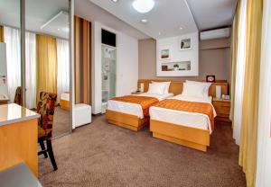 Un pat sau paturi într-o cameră la Hotel Boutique 36