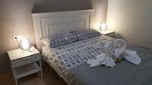 A bed or beds in a room at Apartamento El Pueblo