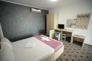 Postel nebo postele na pokoji v ubytování Vila Dorimar Mamaia Nord