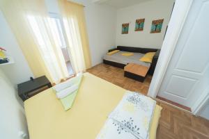 Postel nebo postele na pokoji v ubytování Apartmani Jazz Aleksandra
