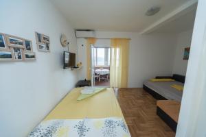 Postel nebo postele na pokoji v ubytování Apartmani Jazz Aleksandra