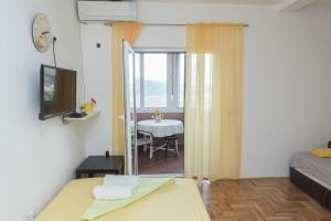 TV a/nebo společenská místnost v ubytování Apartmani Jazz Aleksandra