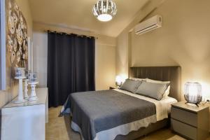 Ліжко або ліжка в номері Agia Kali Villas