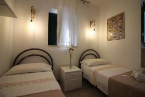 A bed or beds in a room at Maison MilleOttocento