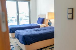 En eller flere senge i et værelse på Lisbon White Cozy Apartment