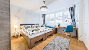 Postel nebo postele na pokoji v ubytování UrbanApartment in CENTER #FREEPARKING #COZY