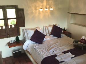 Postel nebo postele na pokoji v ubytování Hotel Casitas Barro Iza Boyaca