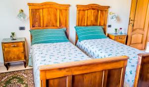 Łóżko lub łóżka w pokoju w obiekcie Il Grappolo